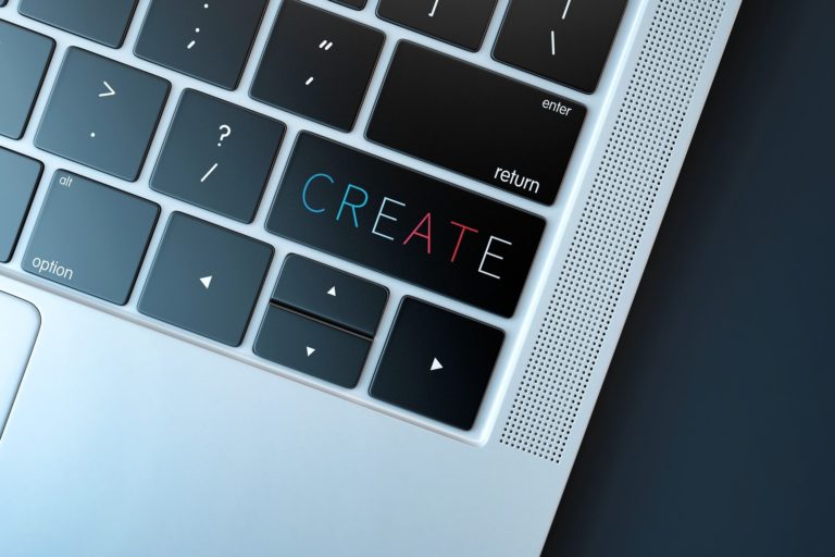 laptop with the word create where the return key would be